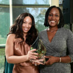 Vernessa Scurry (<em>left</em>) presents the Santé Outstanding Mental Health Practitioner Award to Odelia B. Muir.
